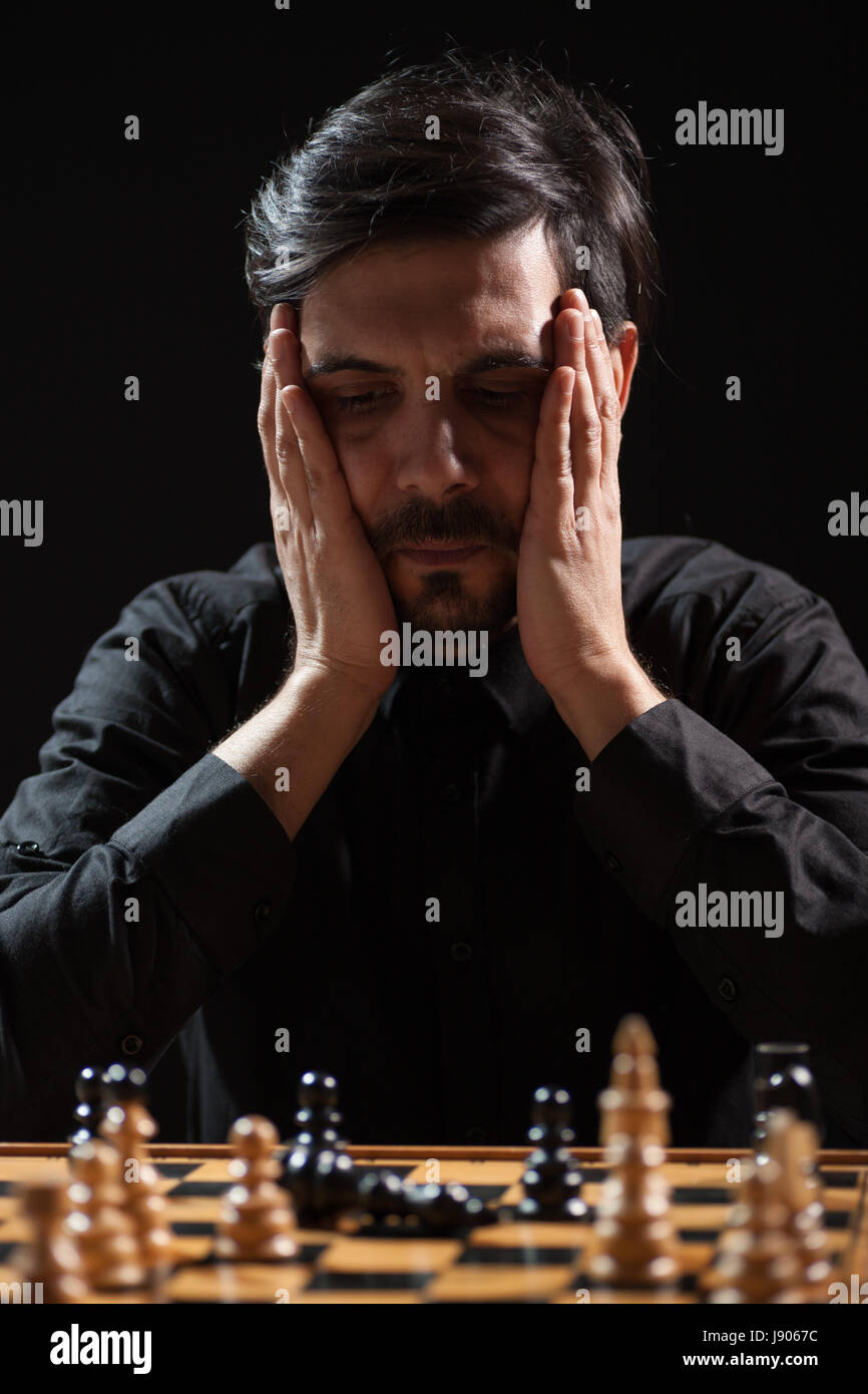 Portrait of adult man who capitulated in chess game. Stock Photo
