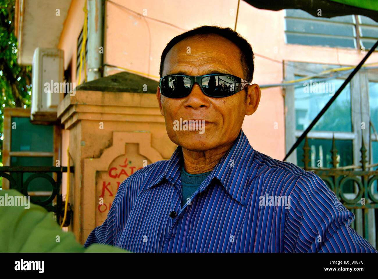 A sunglasses vendor, Vinh city, Vietnam Stock Photo