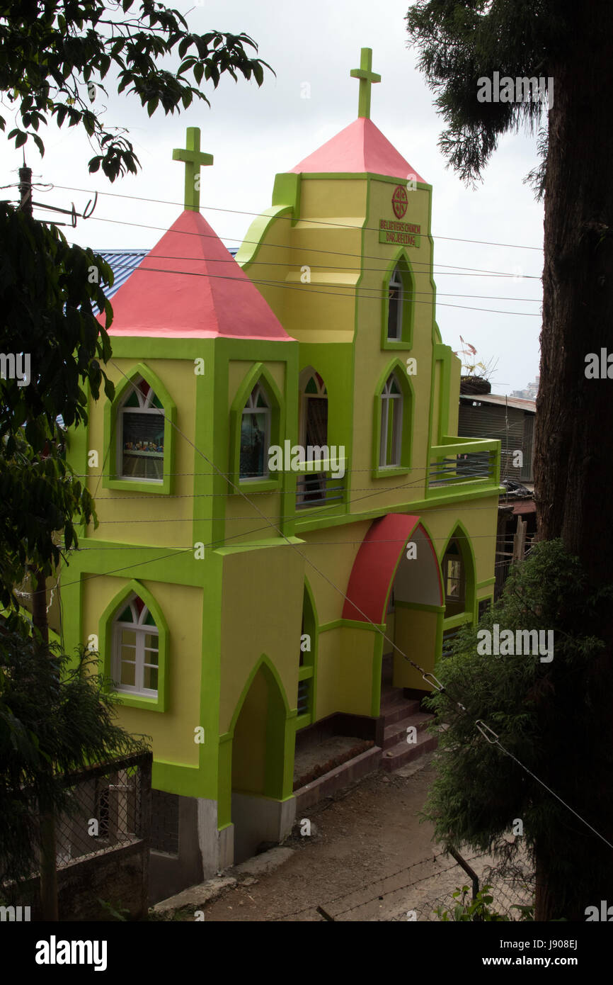 Newly built lime green painted church outside Lloyds Botanic Gardens Darjeeling West Bengal India Stock Photo