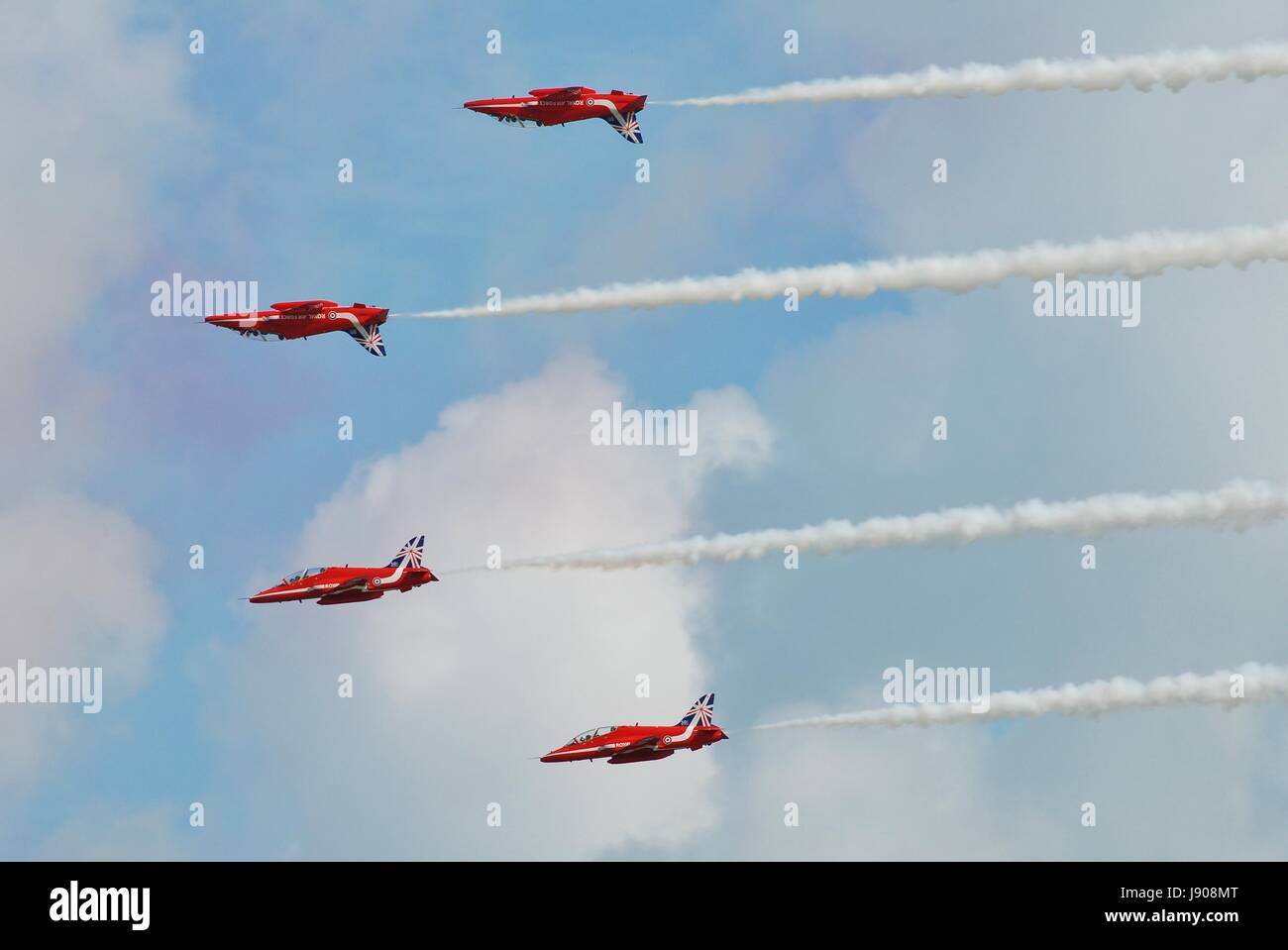 RAF aerobatic display team The Red Arrows display at the Airbourne airshow at Eastbourne, England on August 14, 2014. Stock Photo