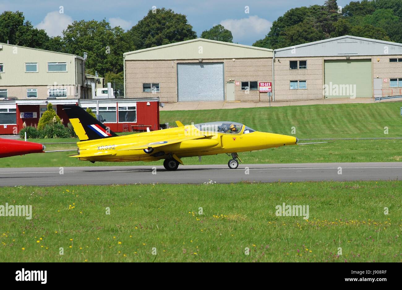 Folland Gnat T Mark 1 trainer jet XR991 of the Gnat Display Team taking off at the Dunsfold airshow in Surrey, England on August 23, 2014. Stock Photo