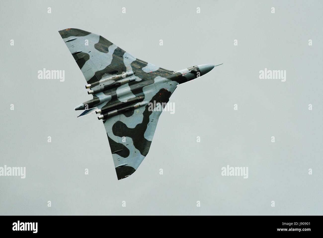 Avro Vulcan bomber jet XH588 gives a display at the Dunsfold airshow in Surrey, England on August 23, 2014. The jet was built in 1960 for the RAF. Stock Photo