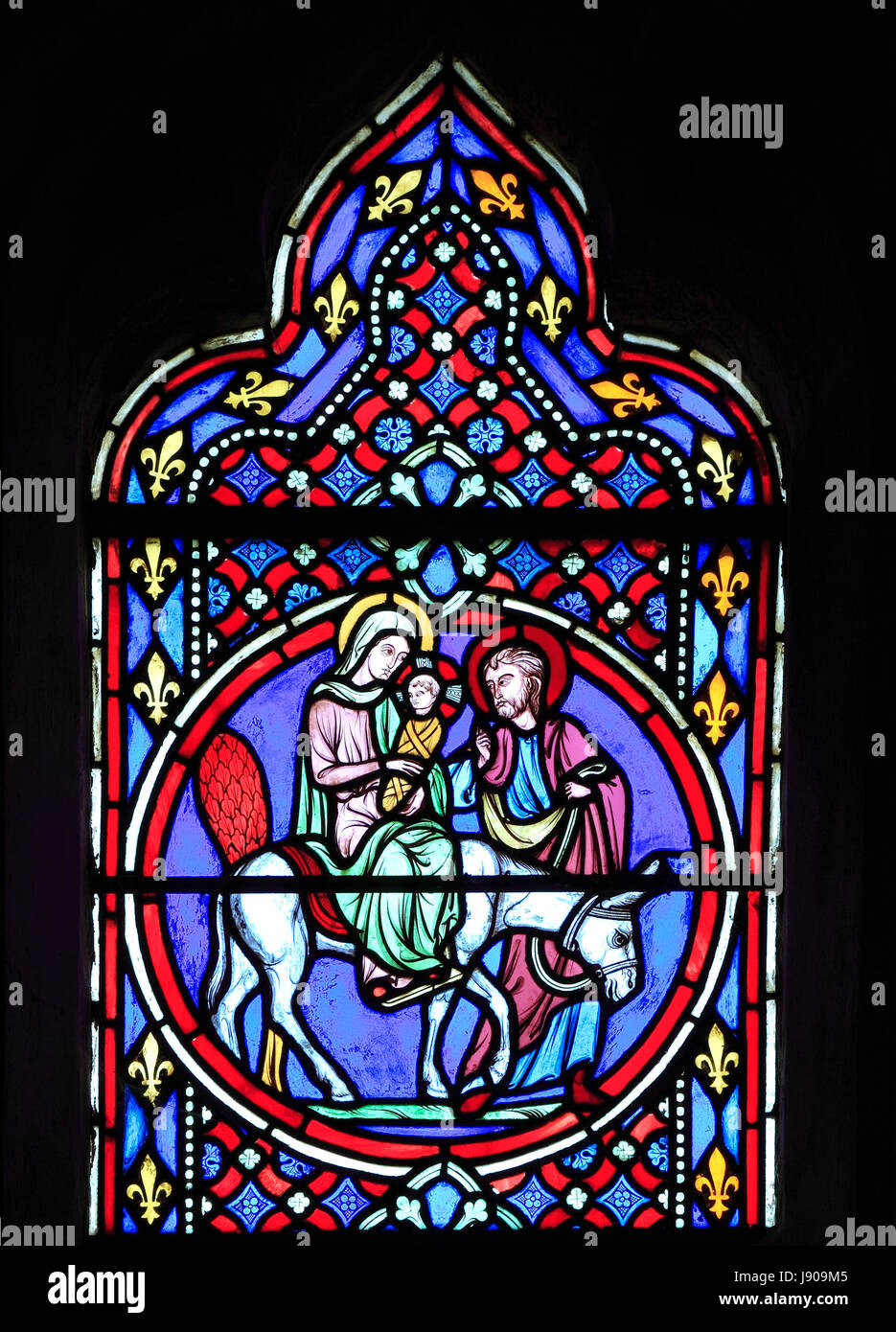 Nativity Window, stained glass by Oudinot of Paris, 1861, Feltwell Church, Norfolk, UK,  Mary Joseph and baby Jesus flee to Egypt Stock Photo