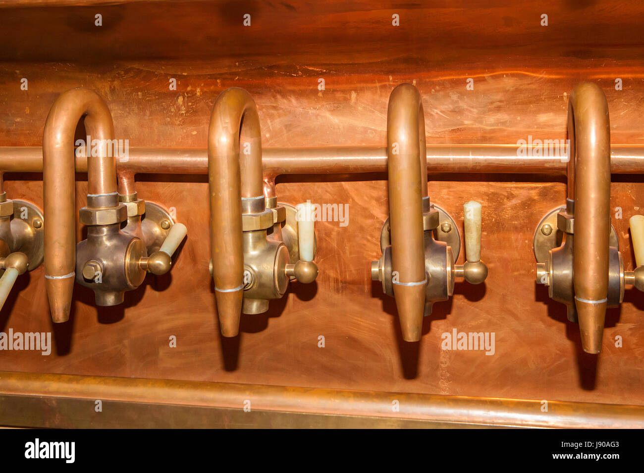 Details of copper taps on an old brewery Stock Photo Alamy