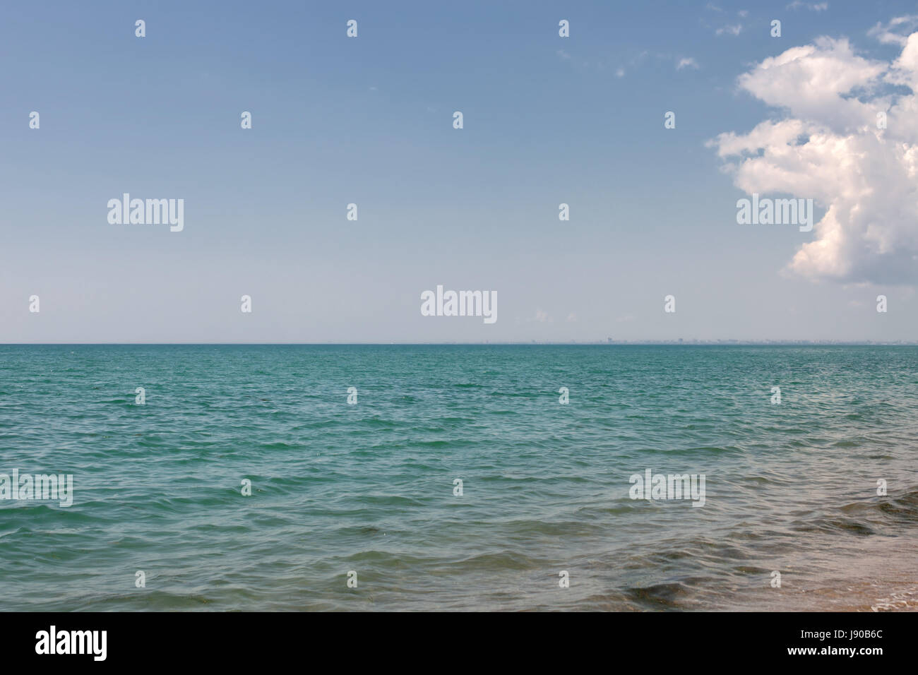 Calm seascape. Clear sky with one cloud and a horizon line Stock Photo ...