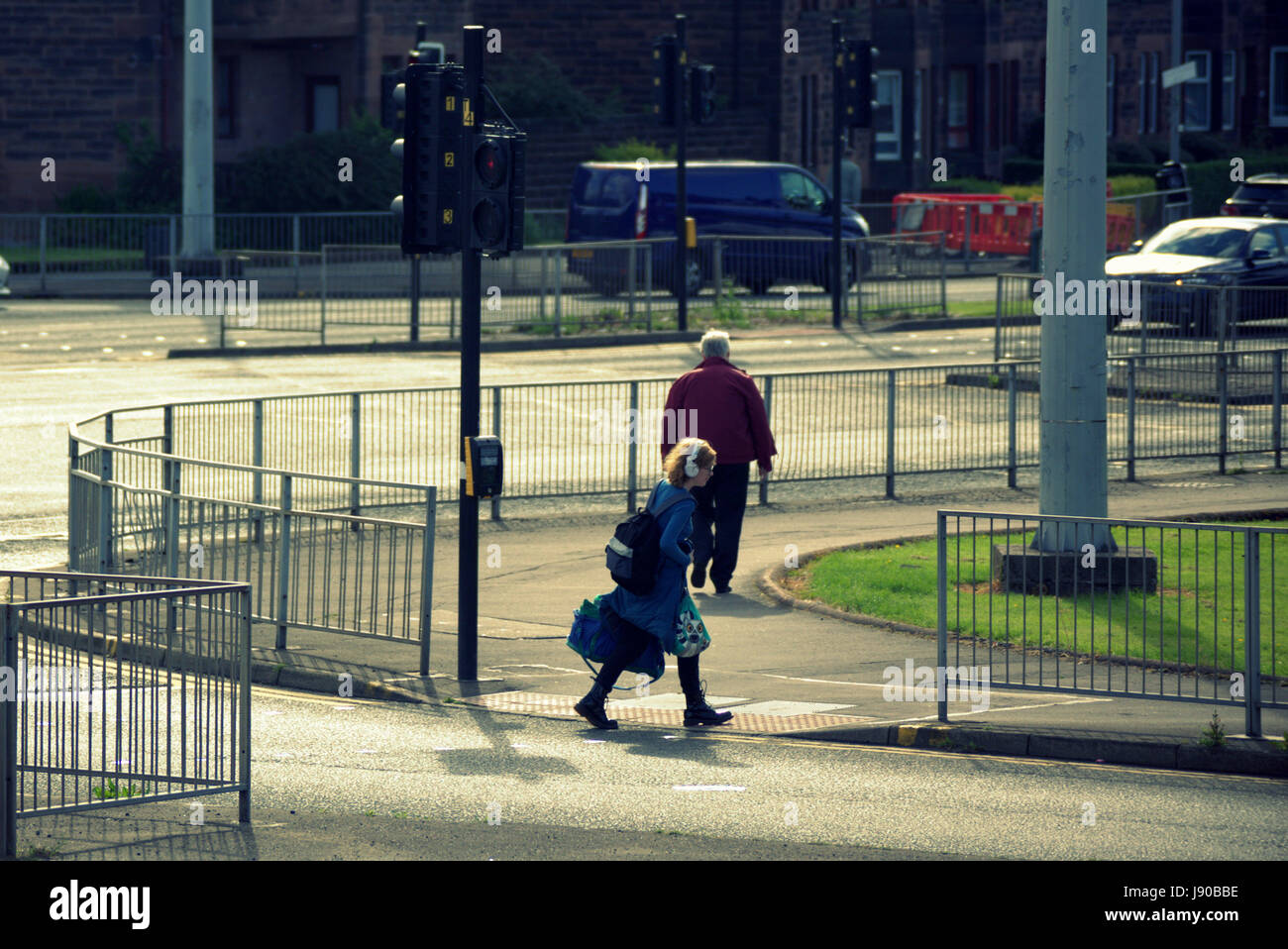 Anniesland cross Glasgow people crossing road at traffic lights at one of the busiest intersects in Europe Stock Photo