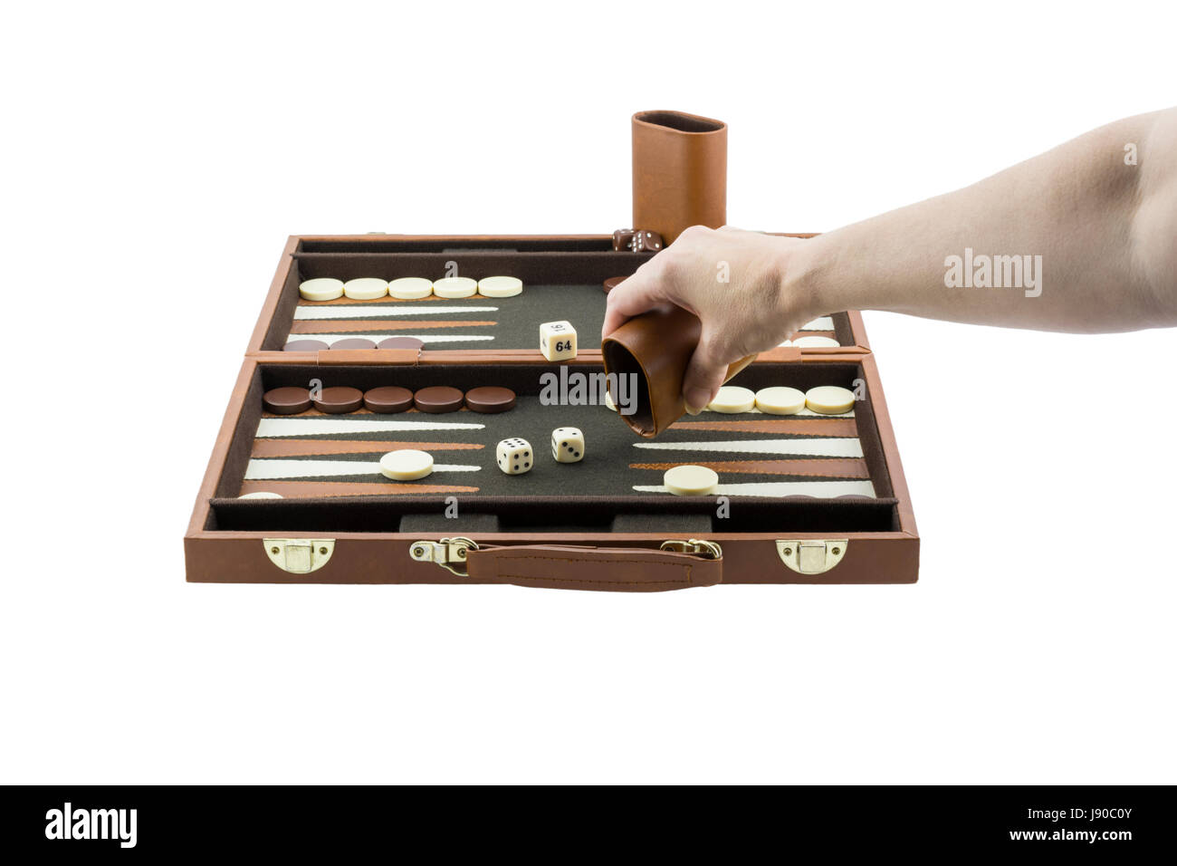 A woman's arm playing backgammon by throwing the die on the backgammon board with her righ hand. Isolated on a pure white background. Stock Photo