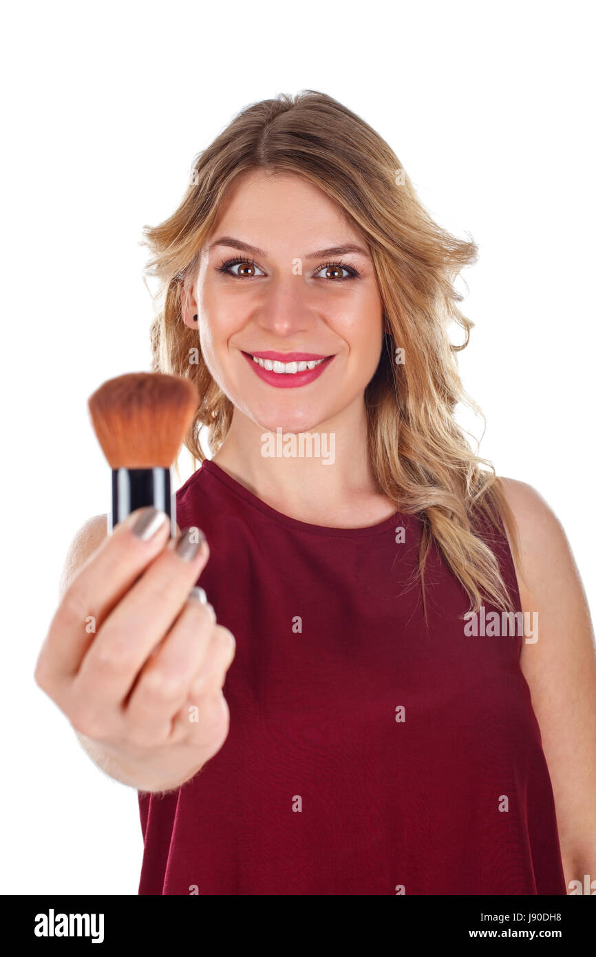 Picture of a beautiful young lady holding a makeup brush Stock Photo