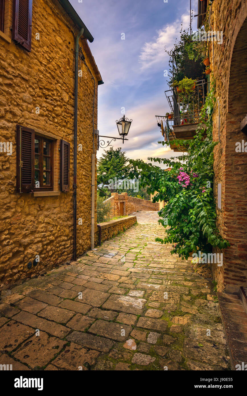 Casale Marittimo old stone village in Maremma on sunset. Picturesque flowery street and traditional houses. Tuscany, Italy Europe. Stock Photo