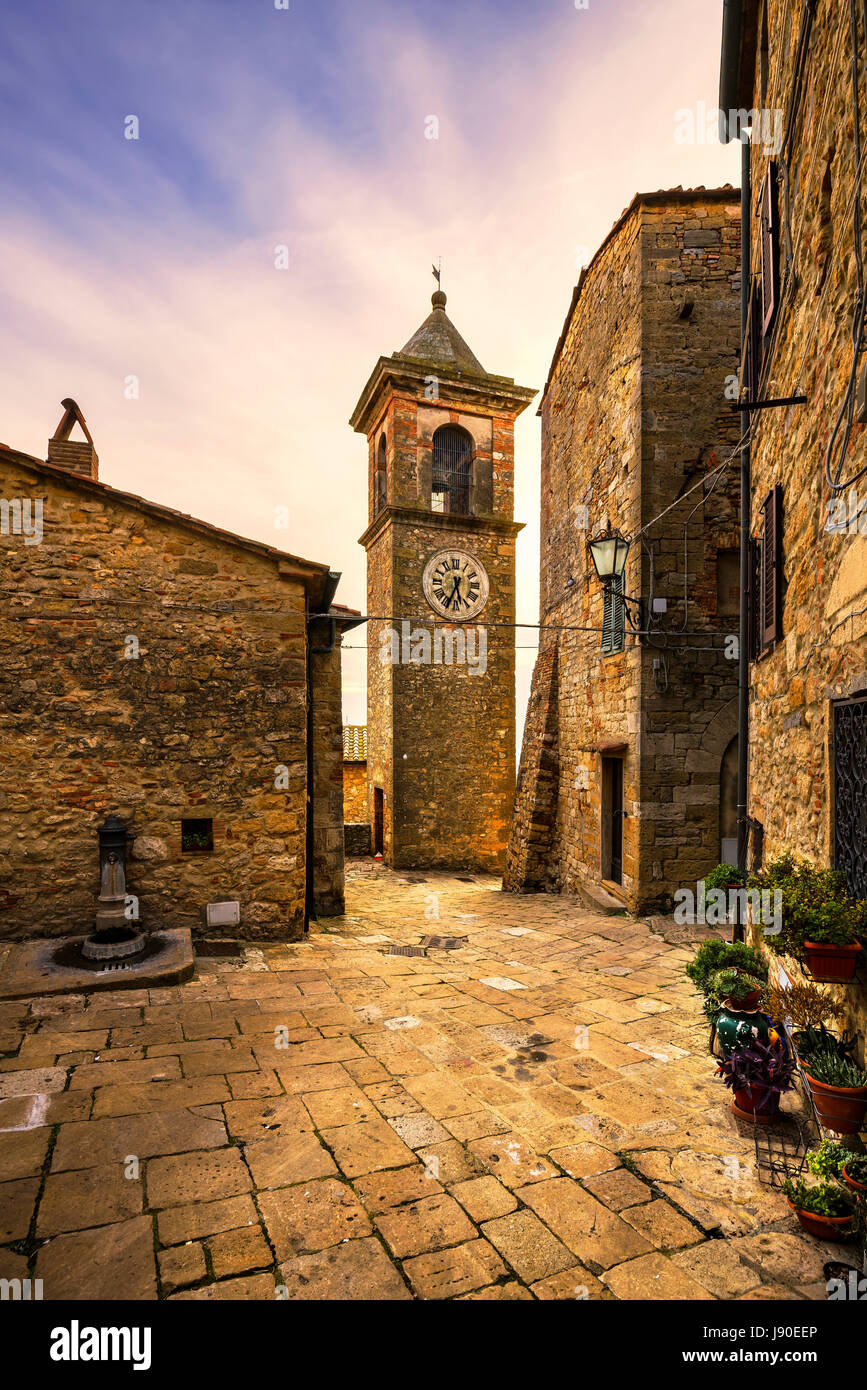 Casale Marittimo old stone village in Maremma on sunset. Picturesque flowery square and campanile tower. Tuscany, Italy Europe. Stock Photo