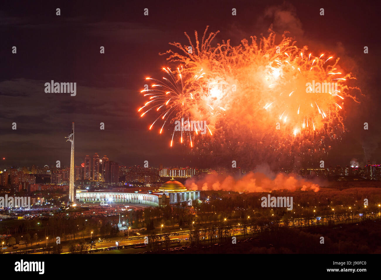 Bright fireworks explosions in night sky in Moscow, Russia Stock Photo