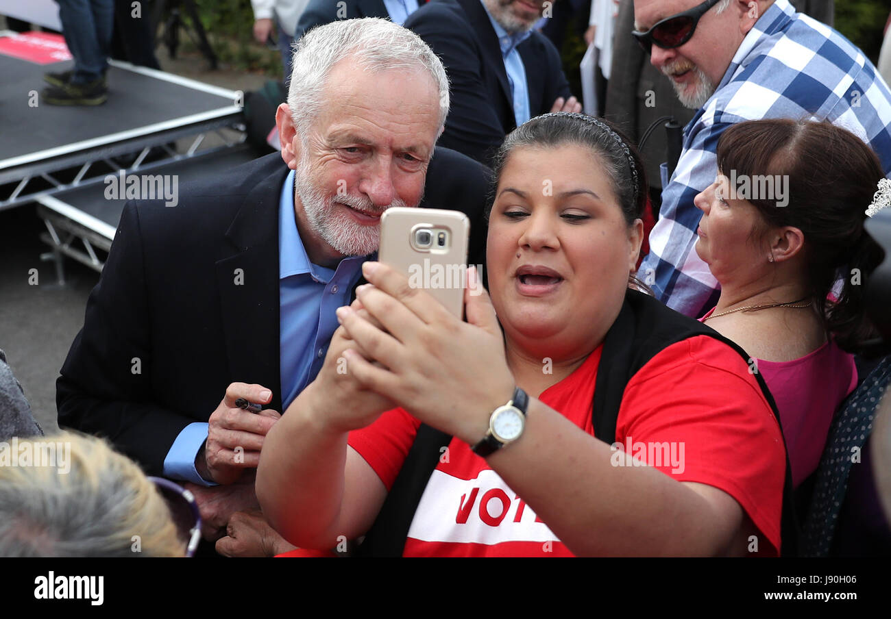 Labour leader Jeremy Corbyn has a photo taken with a supporter during a ...