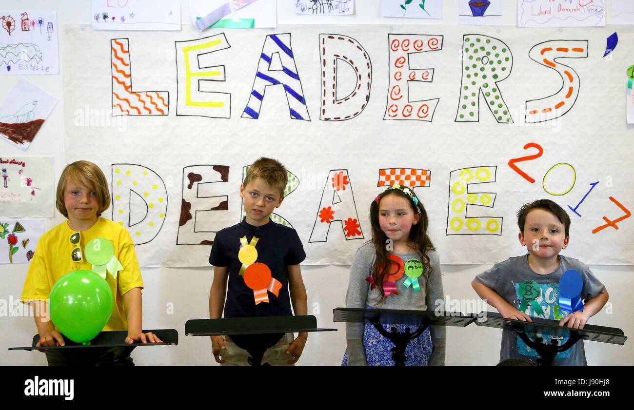 Children prepare for a mock debate where they will play the leaders and leader Tim Farron will moderate, at Liberal Democrats' headquarters in Westminster, London. Stock Photo