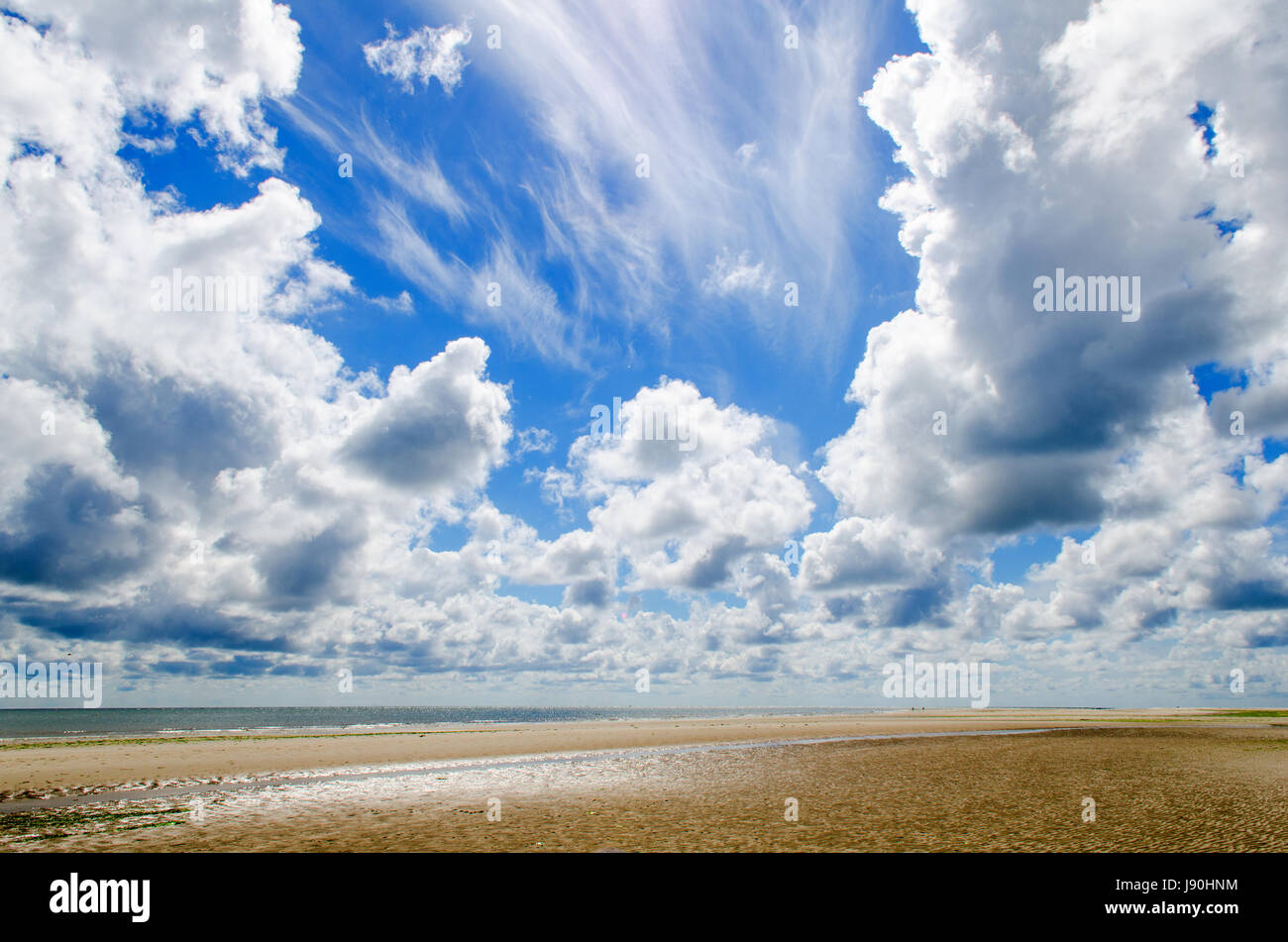 beach with a cloudy sky Stock Photo - Alamy