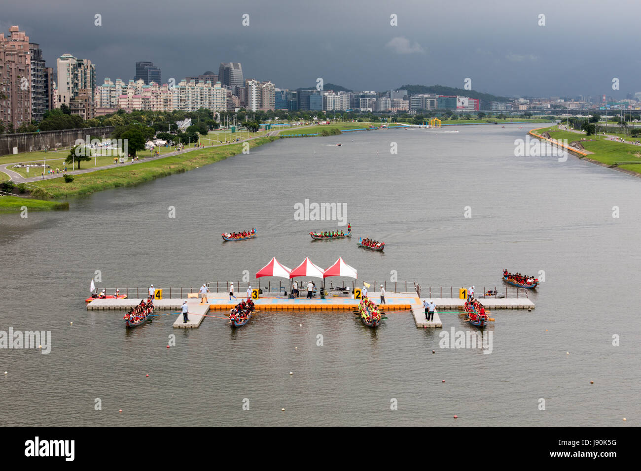 Taipei, Taiwan. 30th May, 2017. Four dragon boats wait for the start signal at the dragon boat races that take place on Keelung River in Taipei every year on Duanwu Festival, better known as Dragon Boat Festival. Credit: Perry Svensson/Alamy Live News Stock Photo