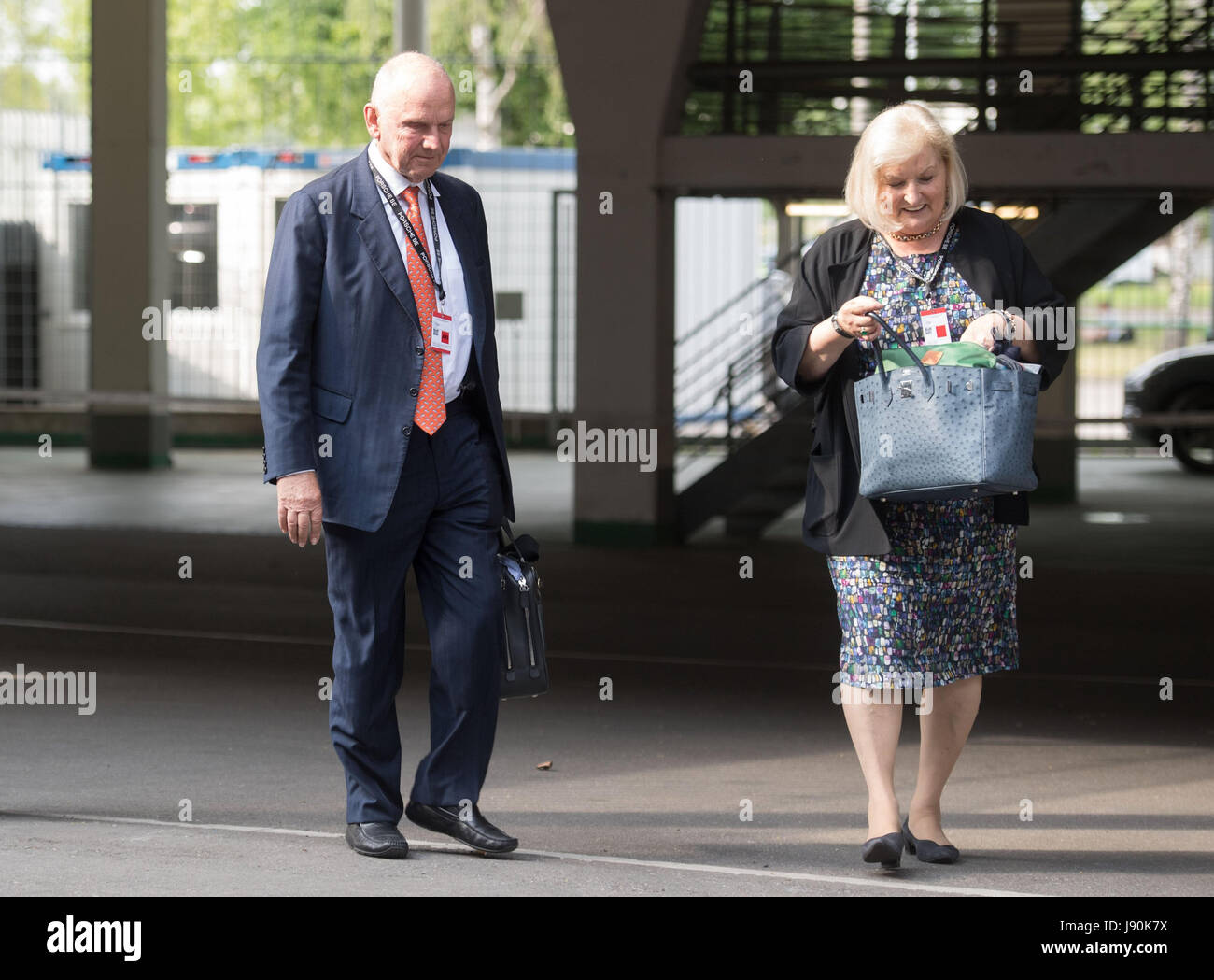 Stuttgart, Germany. 30th May, 2017. Member of the Supervisory Board of Porsche SE, Ferdinand Piech, and his wife Ursula walk towards their car in a parking lot after the company's general annual meeting in Stuttgart, Germany, 30 May 2017. Photo: Marijan Murat/dpa/Alamy Live News Stock Photo