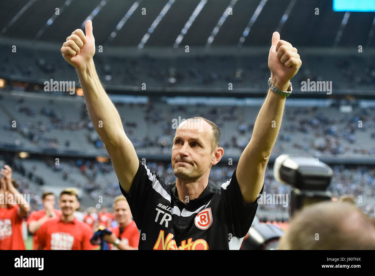 Regensburg's coach Heiko Herrlich celebrates after the German Bundesliga 2nd division relegation soccer match between TSV 1860 Munich and Jahn Regensburg in the Allianz Arena in Munich, Germany, 30 May 2017. Photo: Peter Kneffel/dpa Stock Photo