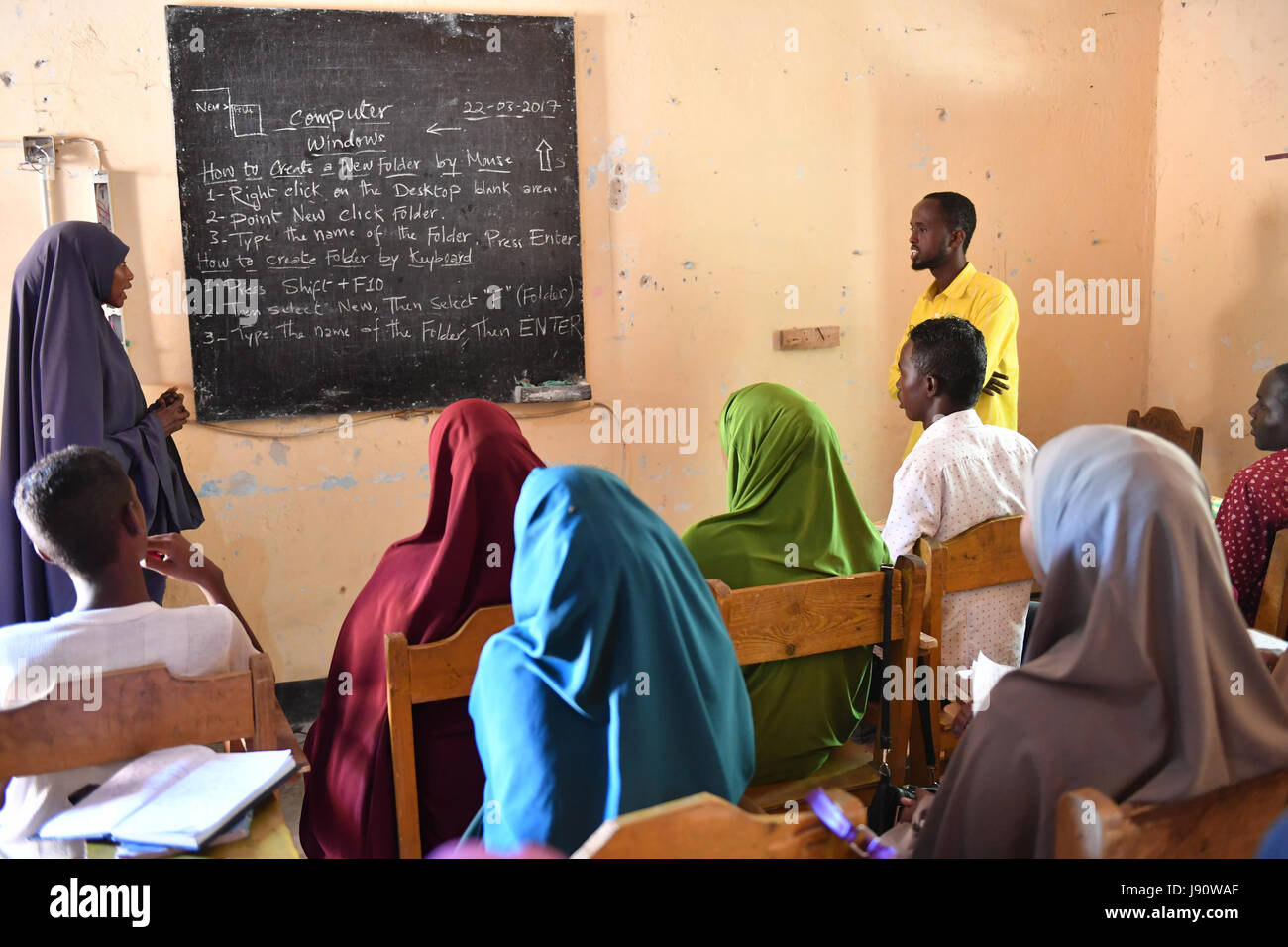 (170531) -- MOGADISHU, May 31, 2017 (Xinhua) -- Trainees take a computer class at the training centre ELMAN, a non-government organization (NGO) which cooperates with the United Nations Children's Fund (UNICEF), in Mogadishu, Somalia, March 22, 2017. By the year of 2017, more than 1630 children and teenagers have taken vocational training courses such as automobile maintenance, basic electricity knowledge and circuit maintenance skills, mobile phone repairing and computer using. A vast majority of the students here were former child soldiers or affected by armed groups. The knowledge and skill Stock Photo