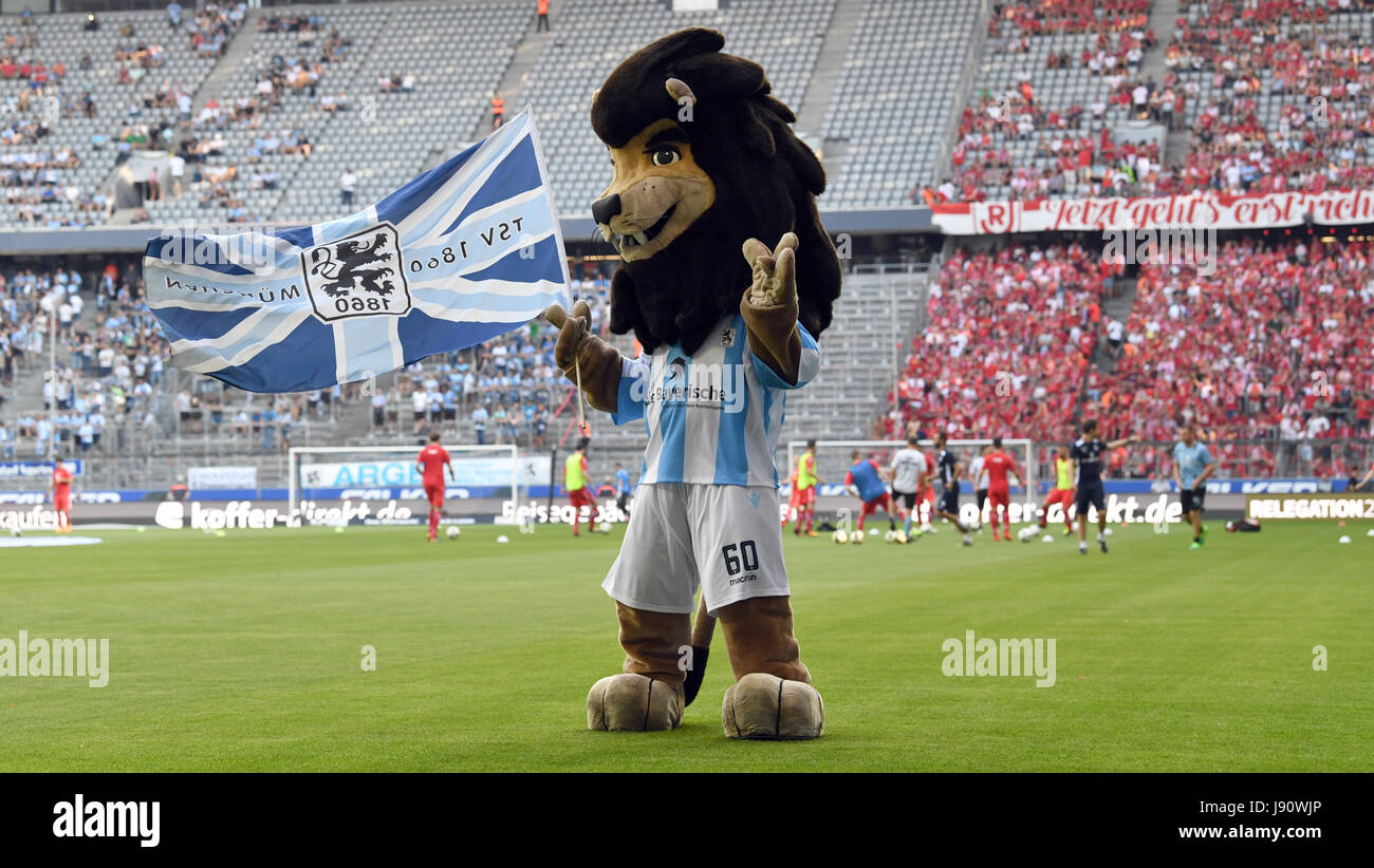 A security guard and Regensburg's goalkeeper Philipp Pentke pick up seats  that were thrown onto the turf during the German Bundesliga 2nd division  relegation soccer match between TSV 1860 Munich and Jahn