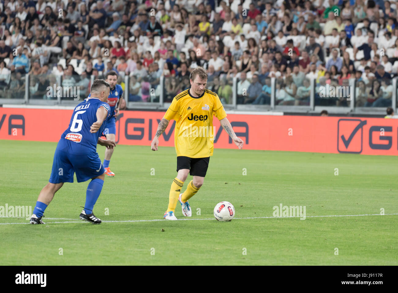 Turin, Italy. 30th May, 2017. Football Charity Match, La Partita del Cuore  2017.Juventus Stadiun, Turin. Singers national football team vs.Champions  of the reasearch football team.Kimi Raikkonen (yellow) and Paolo Belli  (blu) in