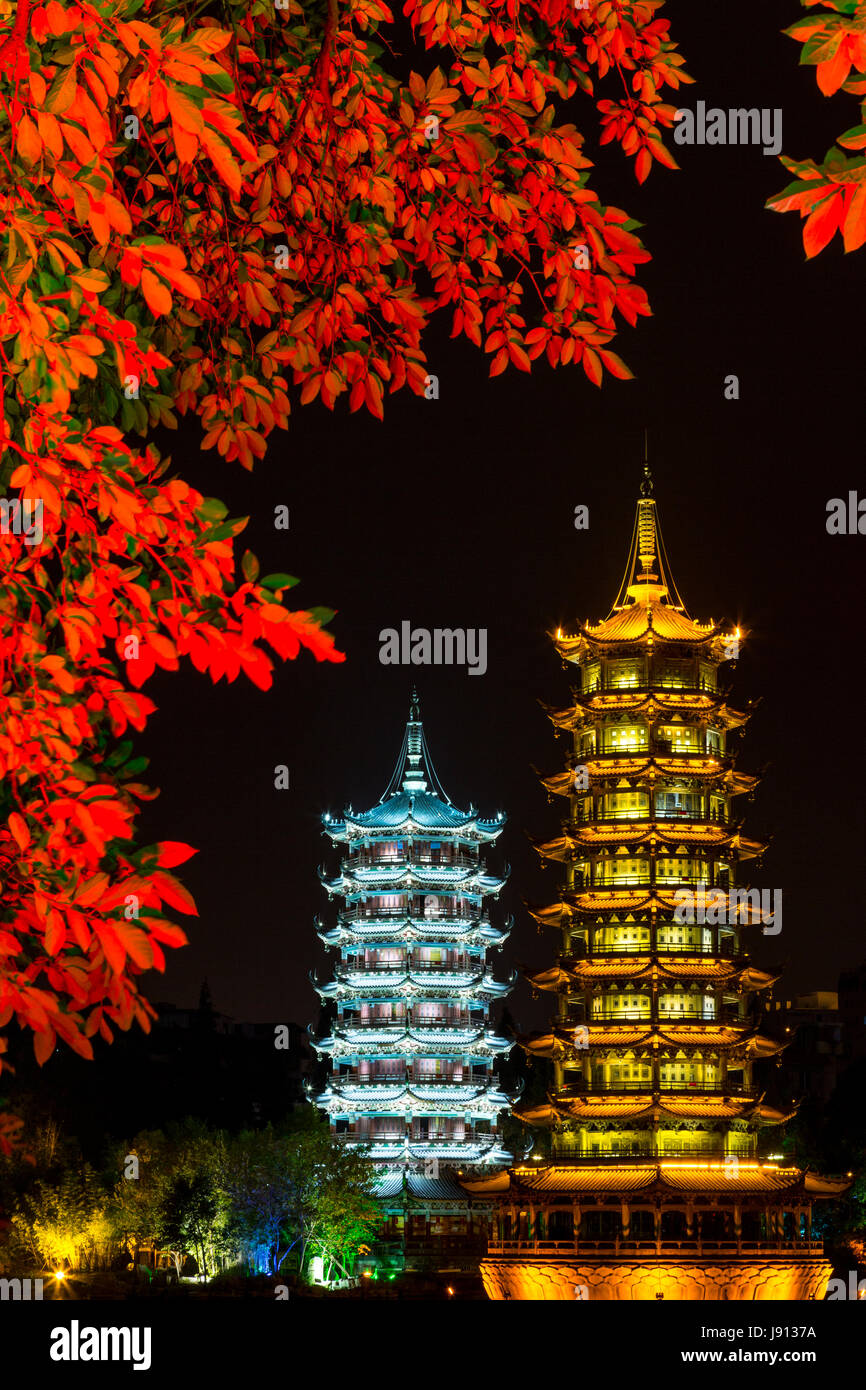 Guilin, China.  Sun and Moon Pagodas beside Shan Lake at Night. Stock Photo
