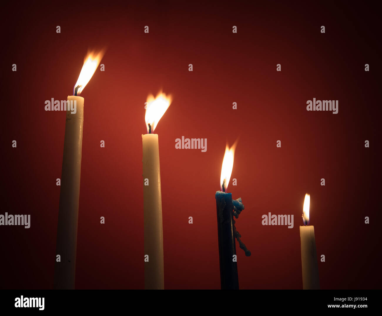 Holy religious candles burning creating a mysterious atmosphere Stock Photo Alamy