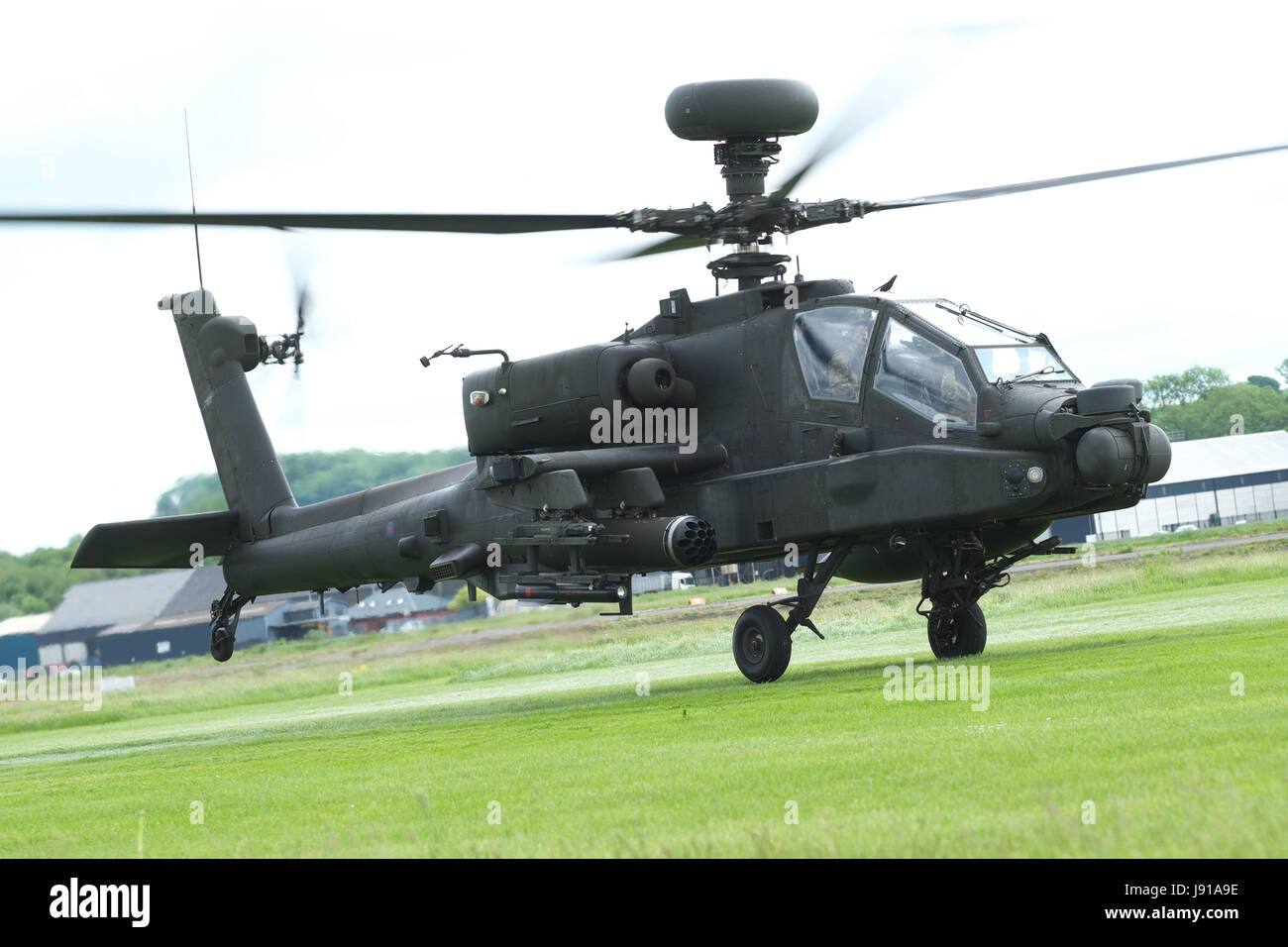 Army Air Corps AH-64 Apache attack helicopter taking off UK Stock Photo