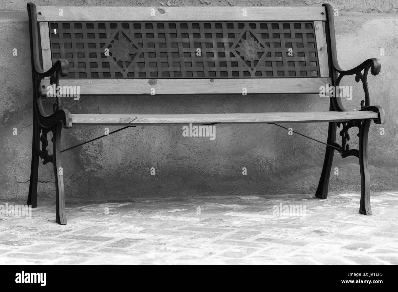 Empty wooden bench wall bench Black and White Stock Photos & Images - Alamy