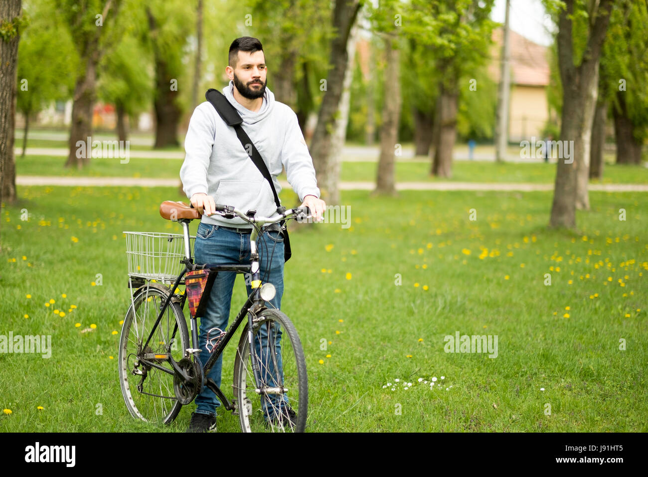 Handsome student man with retro bike Stock Photo