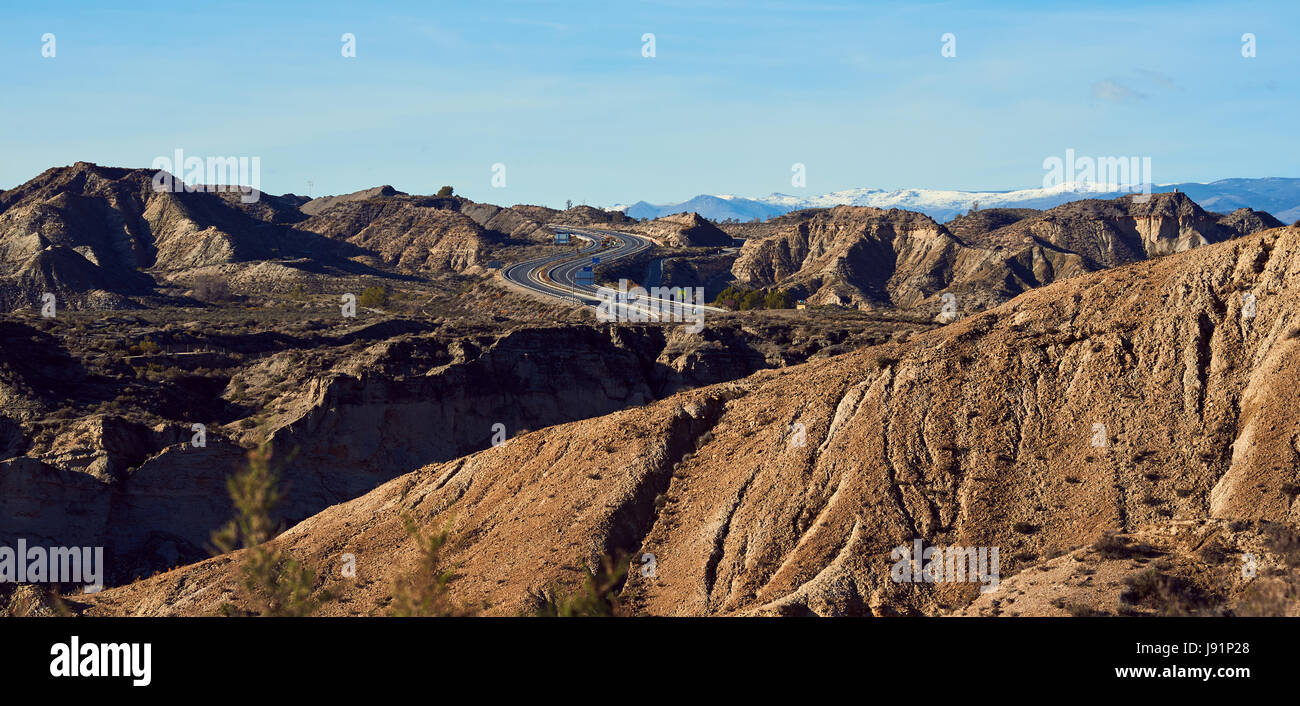 Highway through the slopes of Tabernas desert, one of the most unique ...