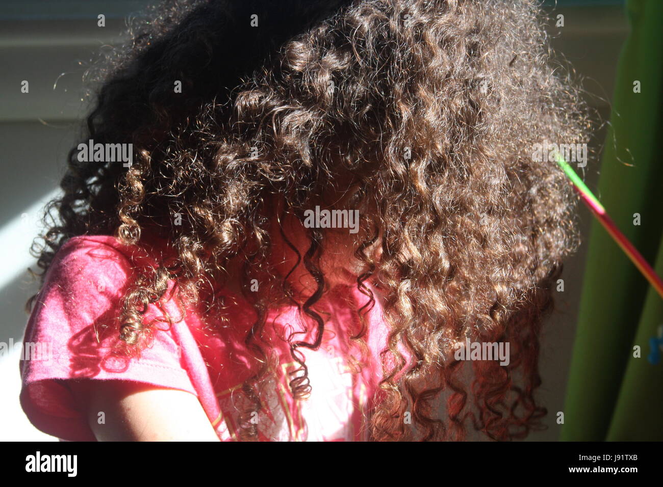 Close Up Of Little Girl S Natural Curly Hair Stock Photo