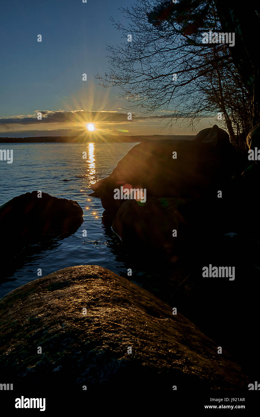 Beautiful sunset reflected on the lake Stock Photo - Alamy