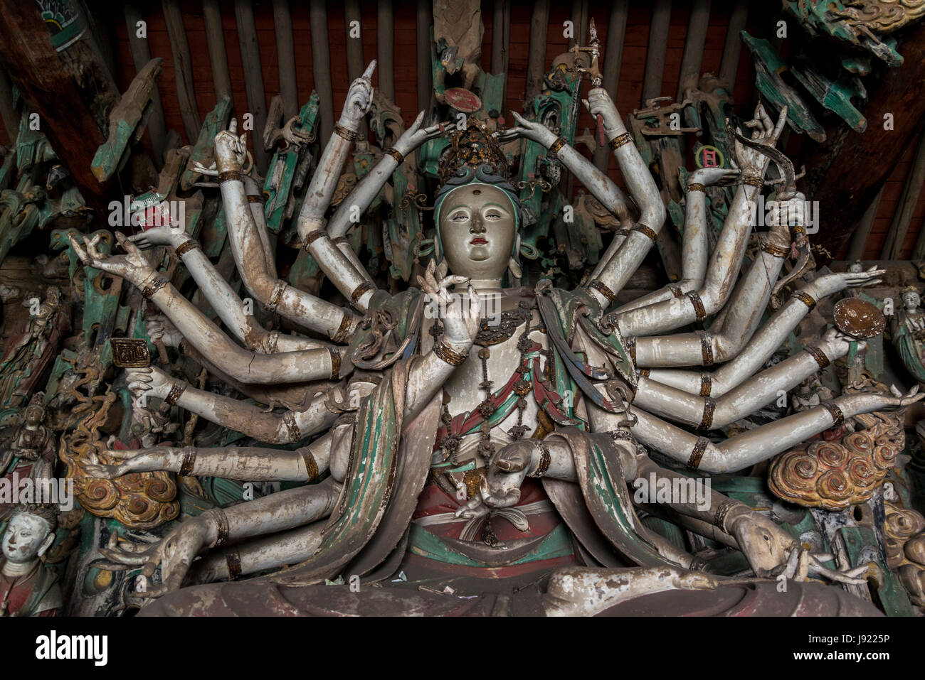 Bodhisattva sculpture with many arms in Bodhisattva Hall, Shuanglin Temple, a large Buddhist temple from the Ming dynasty, Pingyao, Shanxi province, C Stock Photo