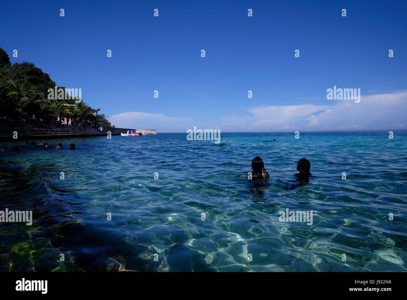 People bathing in Salagdoong Beach in the island of Siquijor located in the Central Visayas region of the Philippines Stock Photo