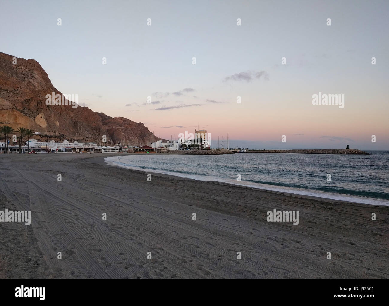 Aguadulce beach at sunset. Aguadulce is a spanish locality of Roquetas de Mar, province of Almeria. Spain Stock Photo