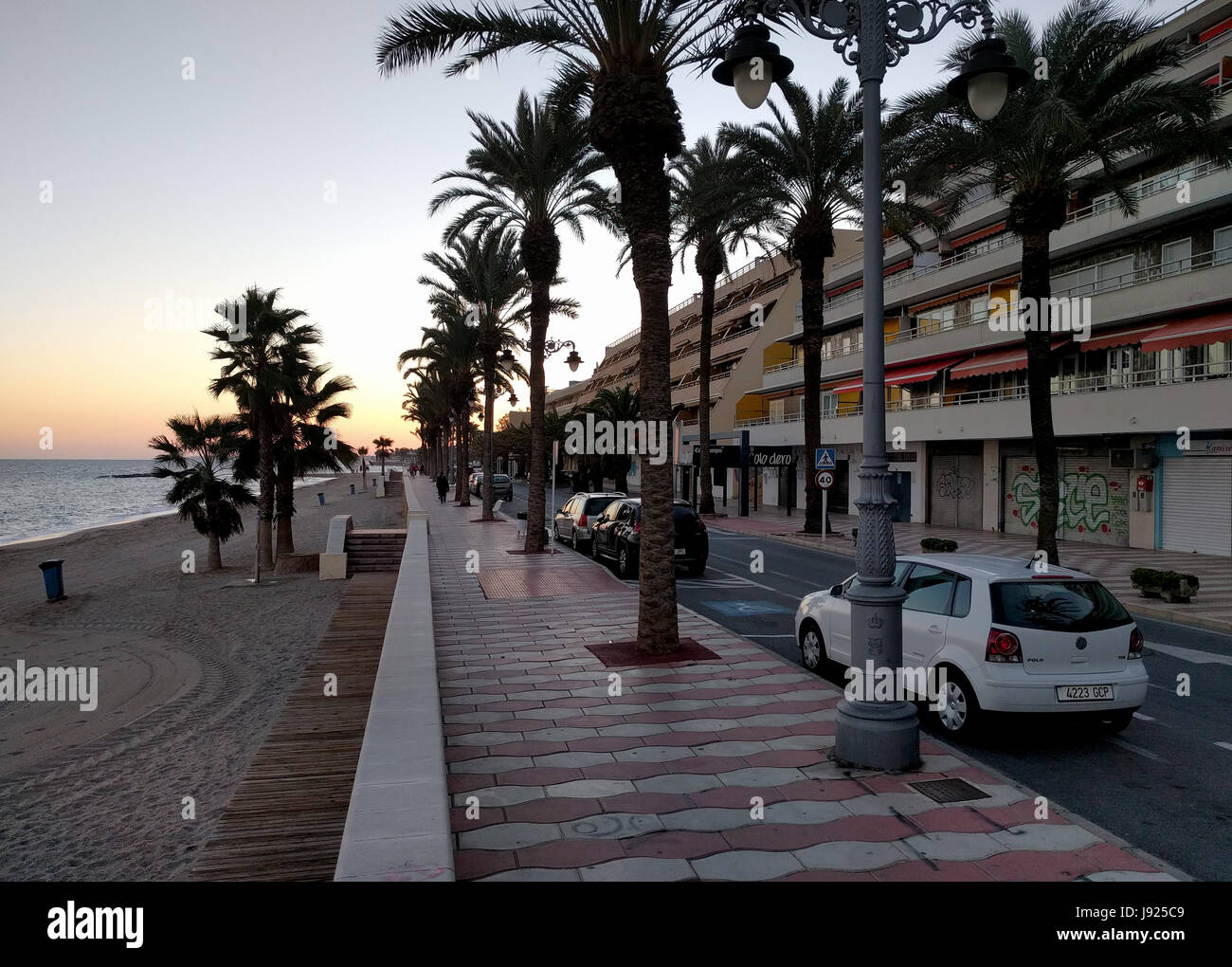 Aguadulce, Spain: December 6, 2016: Promenade of Aguadulce at sunset. Aguadulce is a spanish locality of Roquetas de Mar, province of Almeria. Spain Stock Photo