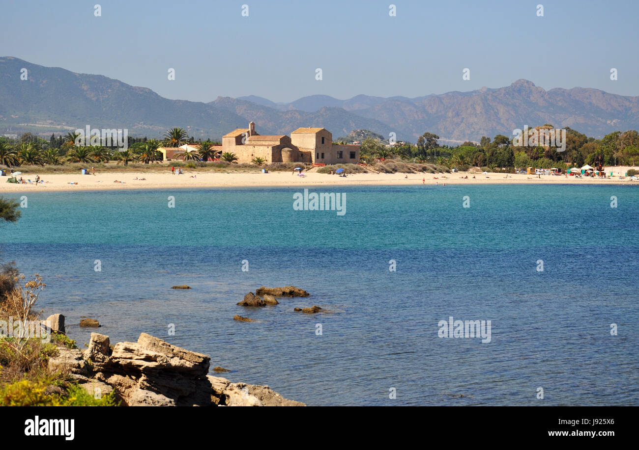 Beeautiful Nora beach and old cathedral view on Sardinia island in Italy - Mediterranean sea Stock Photo