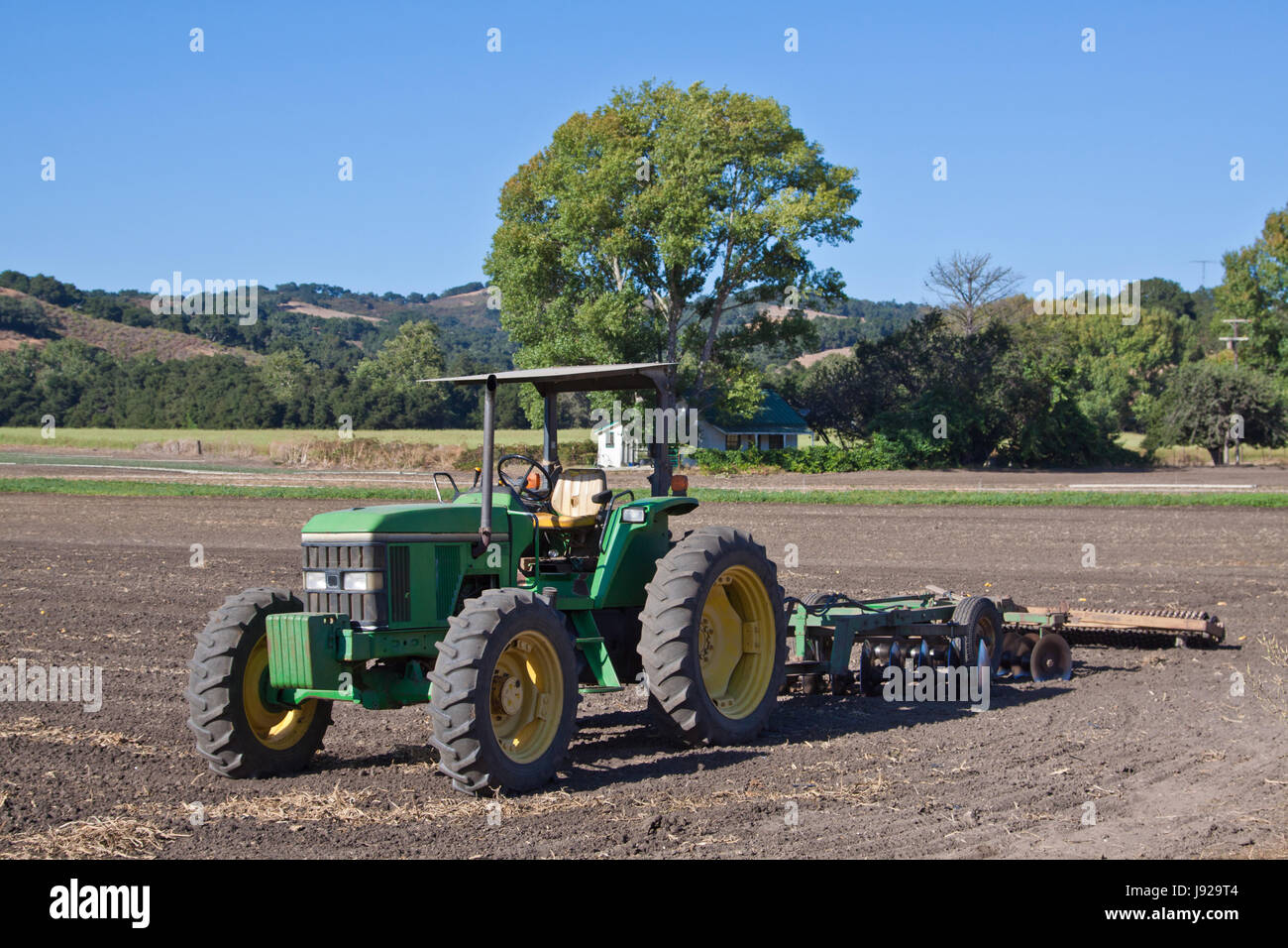 old tractor on the field Stock Photo - Alamy