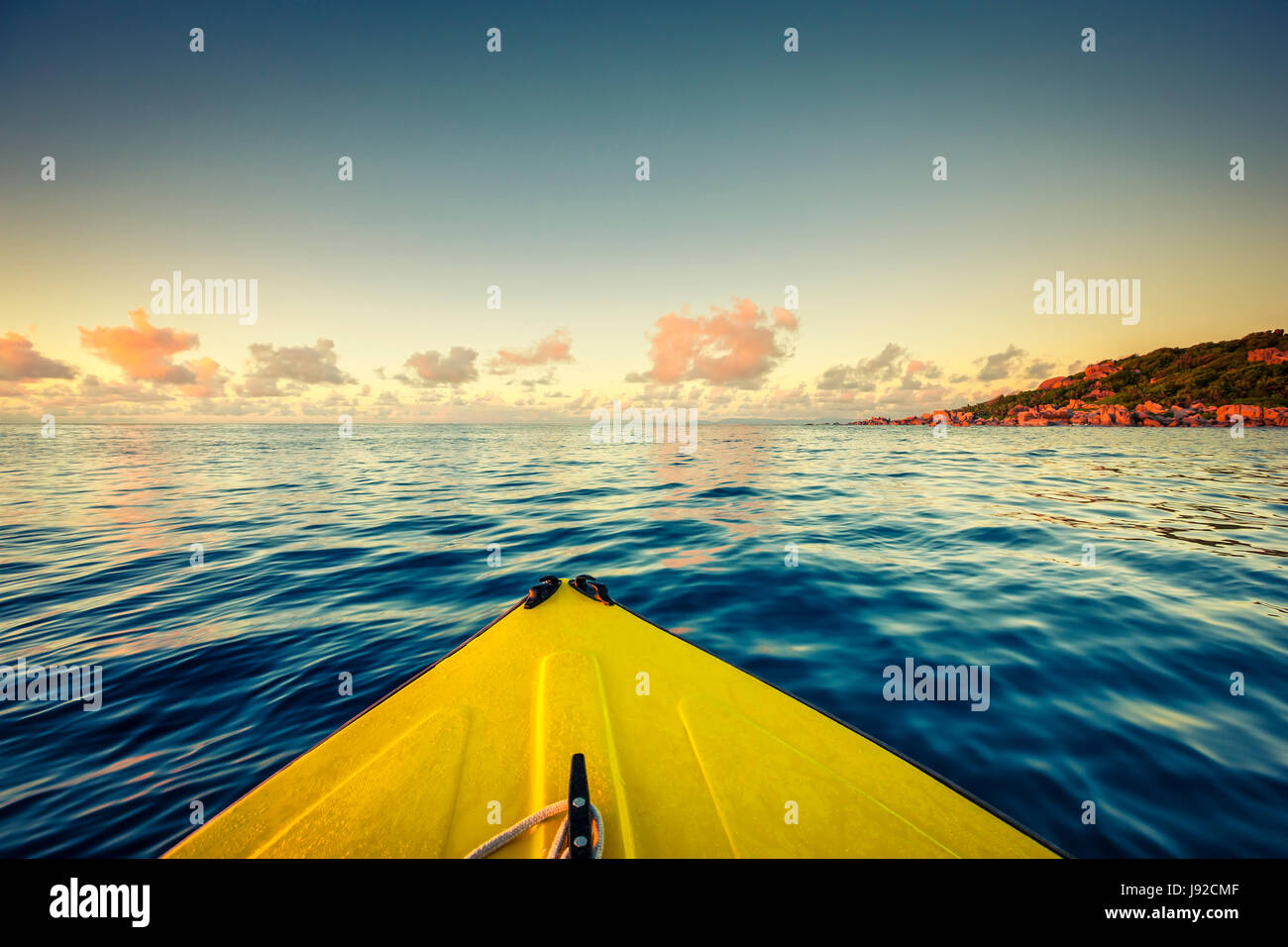 Sailing on yellow boat near Seychelles, La Digue island Stock Photo