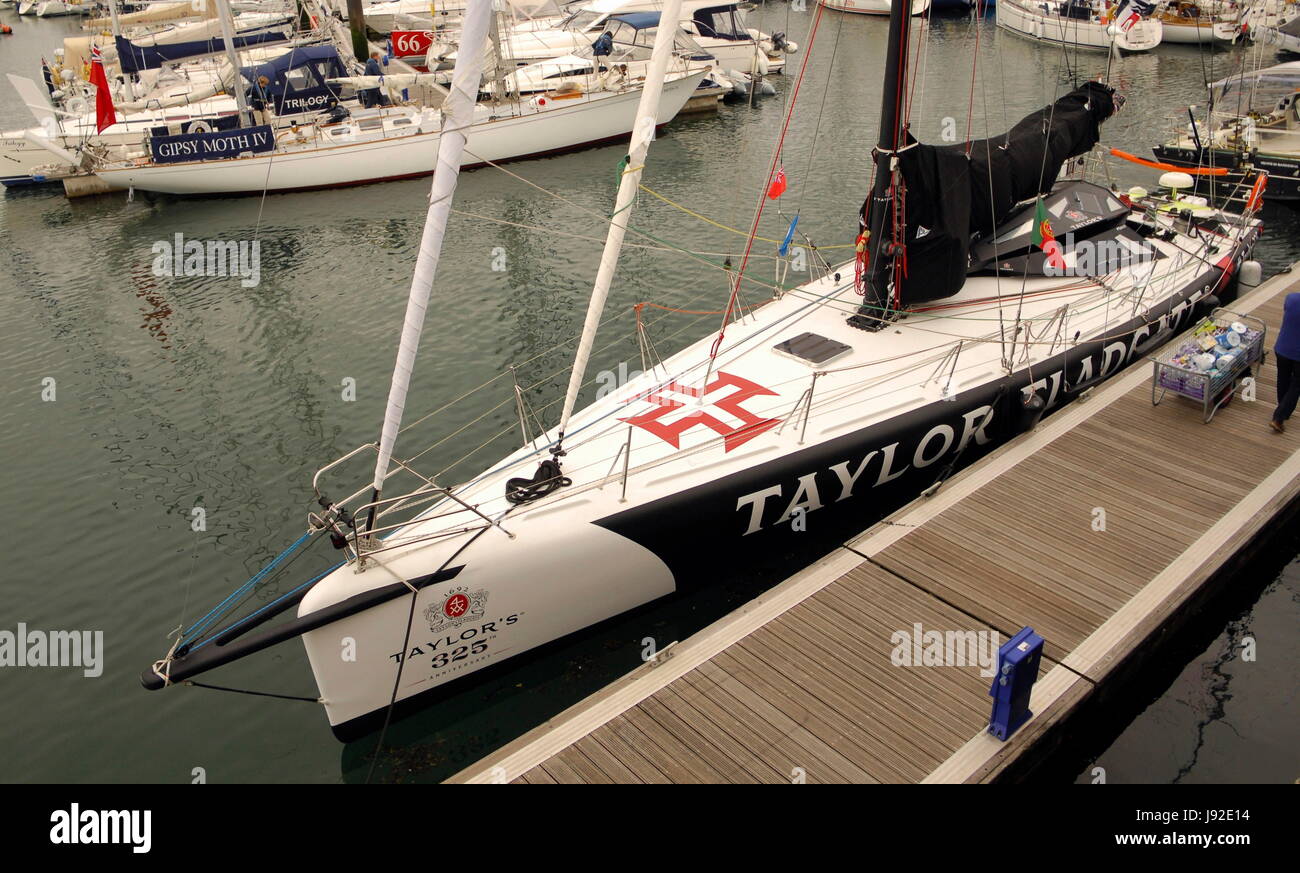 AJAXNETPHOTO. 28TH MAY, 2017. PLYMOUTH, ENGLAND. - TRANSAT - THE OLD AND THE NEW - TWO STAR ENTRY TAYLOR 325, AN OCEAN 60 SKIPPERED BY RICARDO DINIZ OF PORTUGAL (FOREGROUND) MOORED IN QUEEN ANNE'S BATTERY MARINA BEFORE THE START; IN THE BACKGROUND IS SIR FRANCIS CHICHESTER'S GIPSY MOTH IV.  PHOTO:JONATHAN EASTLAND/AJAX REF:D172905 6439 Stock Photo