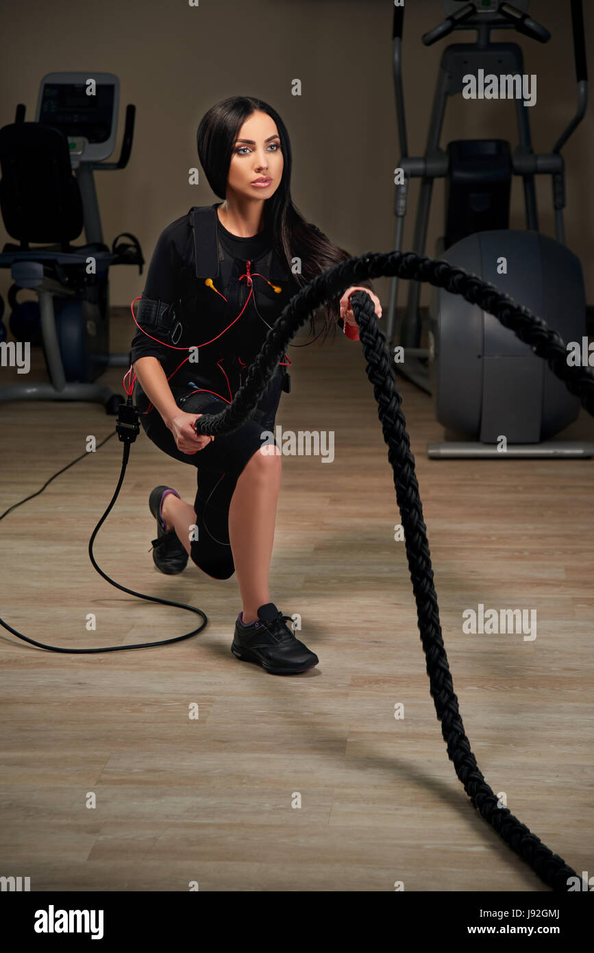 Electrical Muscular Stimulation Fitness Brunette Woman In Full Ems Suit