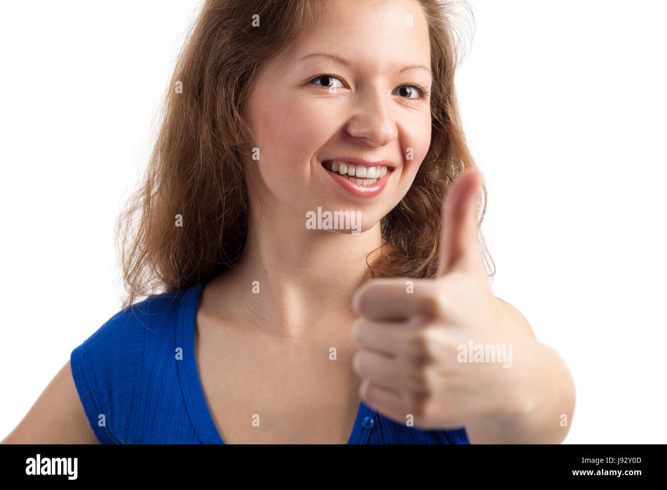 friendly smiling young woman with thumbs up Stock Photo