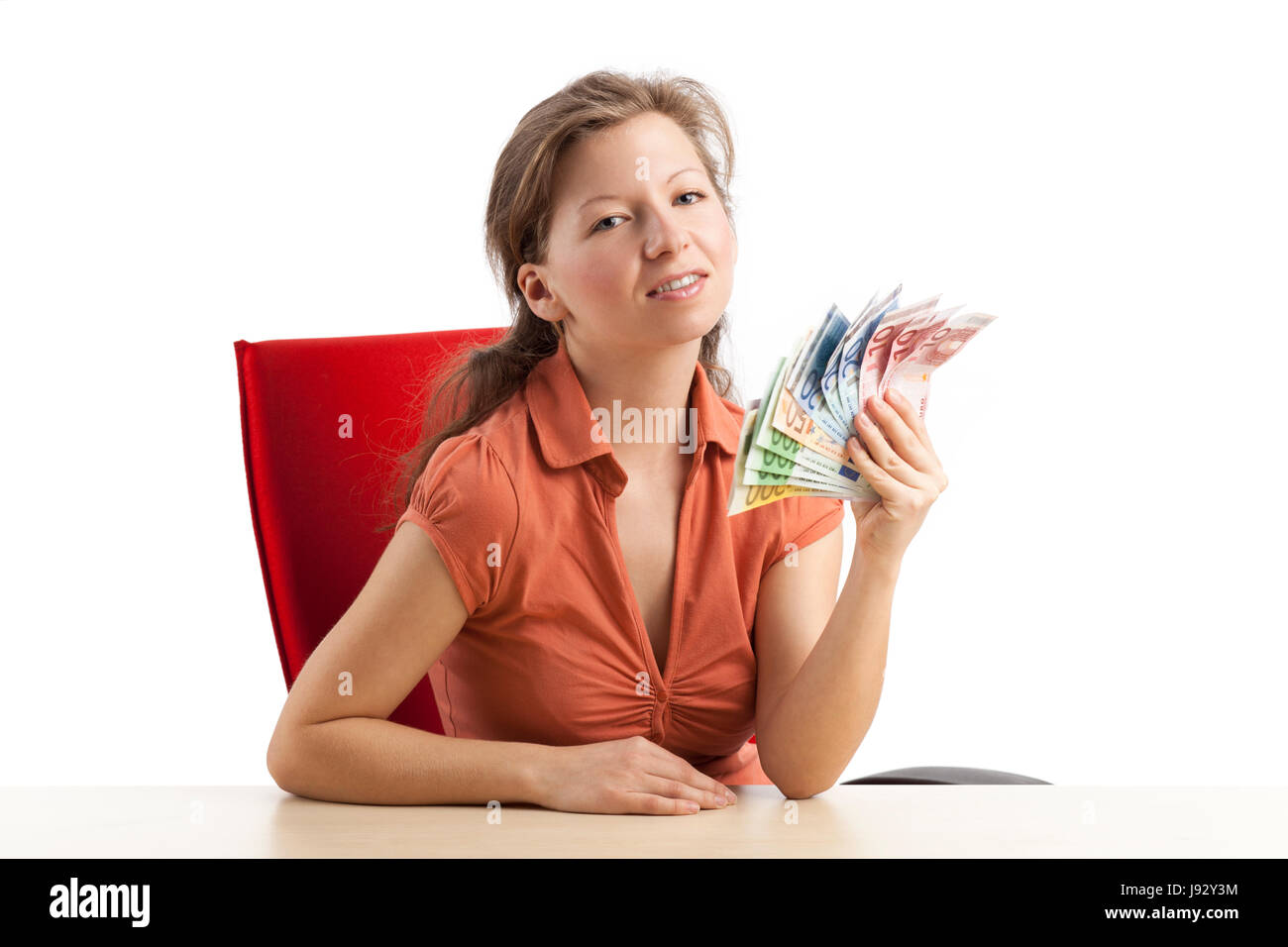 woman fans out with euro bills air Stock Photo