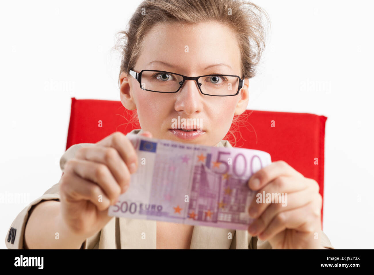 woman holding five hundreds in both hands forward Stock Photo