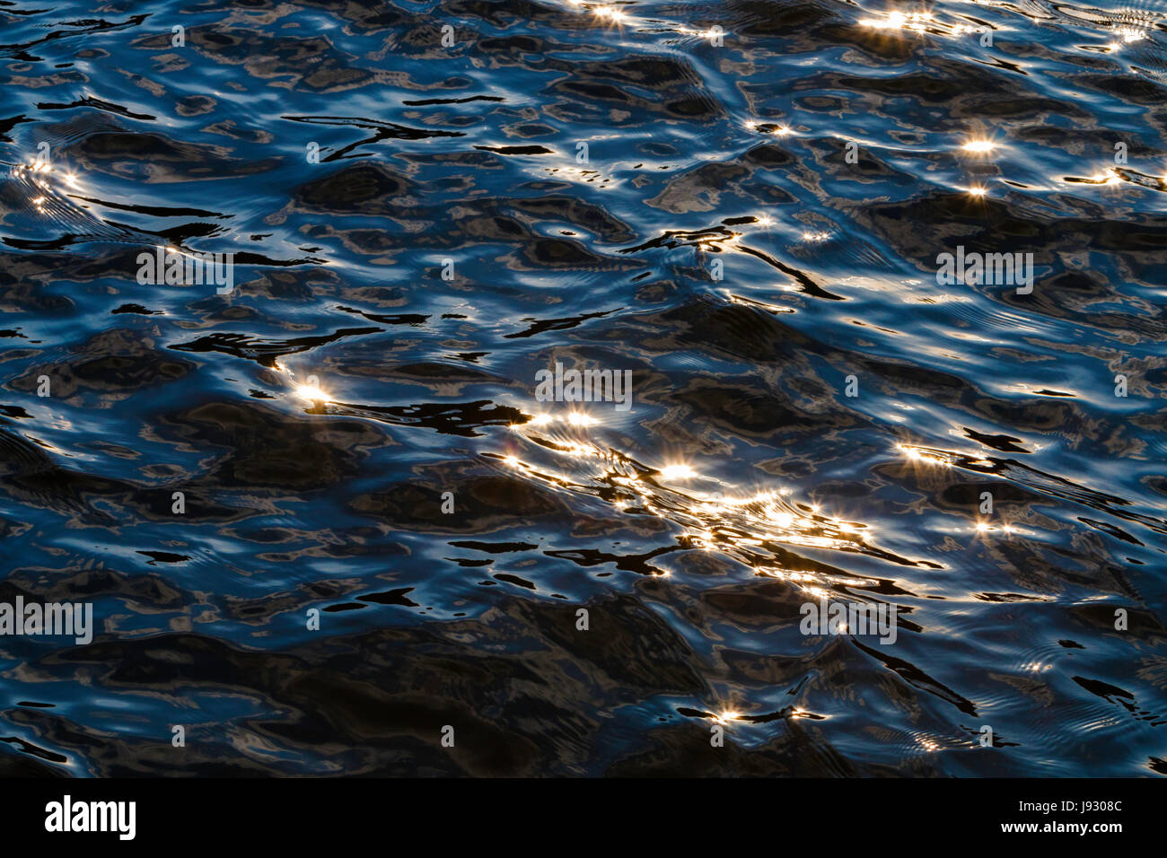 Sunlight reflects off the ripples of Horsetooth Reservoir.  Fort Collins, Colorado. Stock Photo