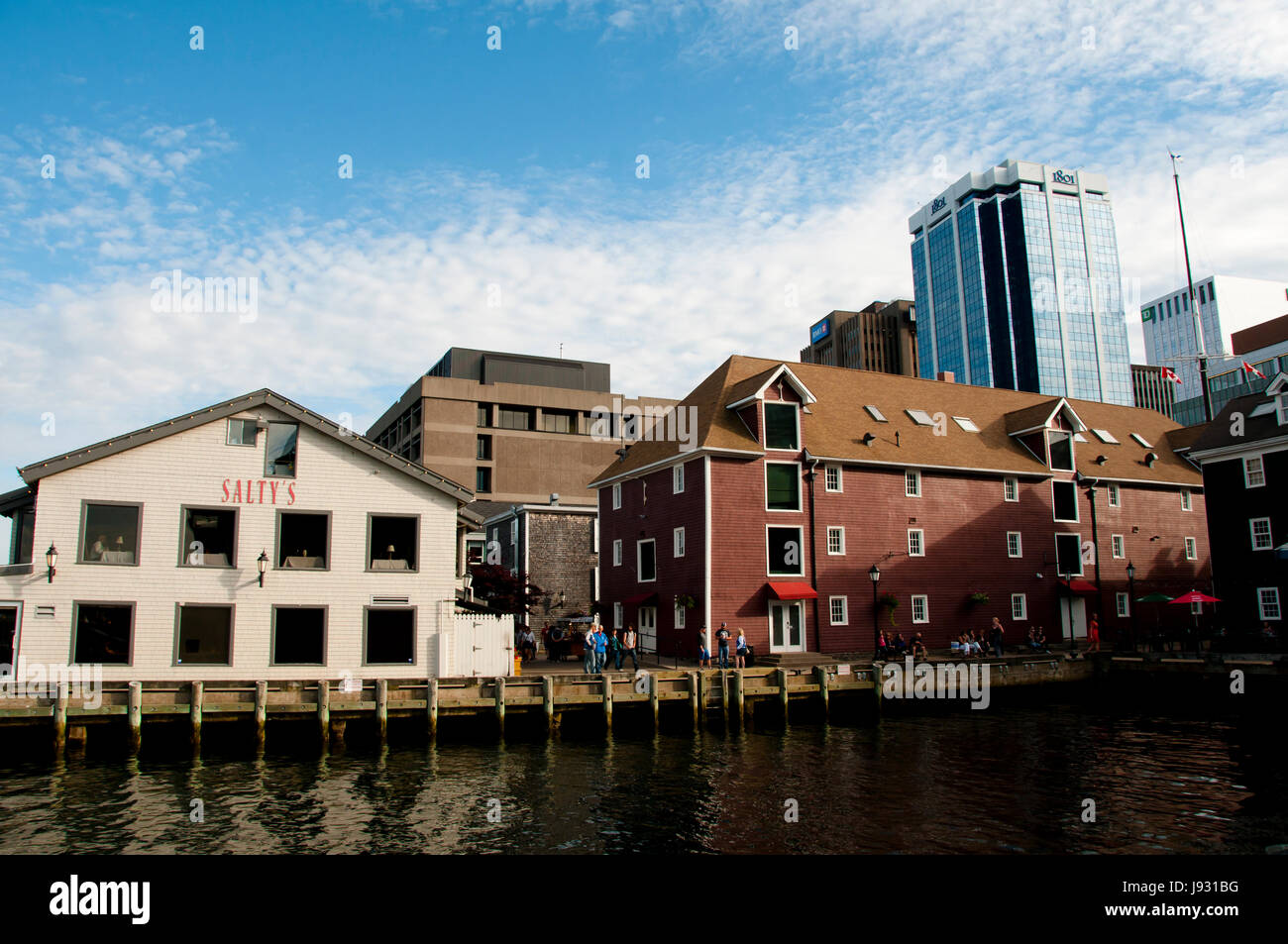HALIFAX, CANADA - August 13, 2016:  The Halifax Waterfront Boardwalk is a public footpath and a tourist destination popular for its shops and restaura Stock Photo