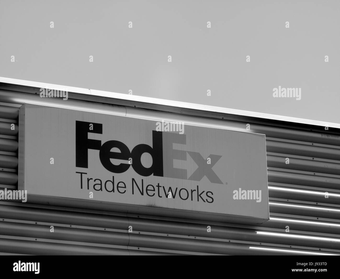 FedEx Corporation sign mounted on side of building, American courier delivery service company Stock Photo