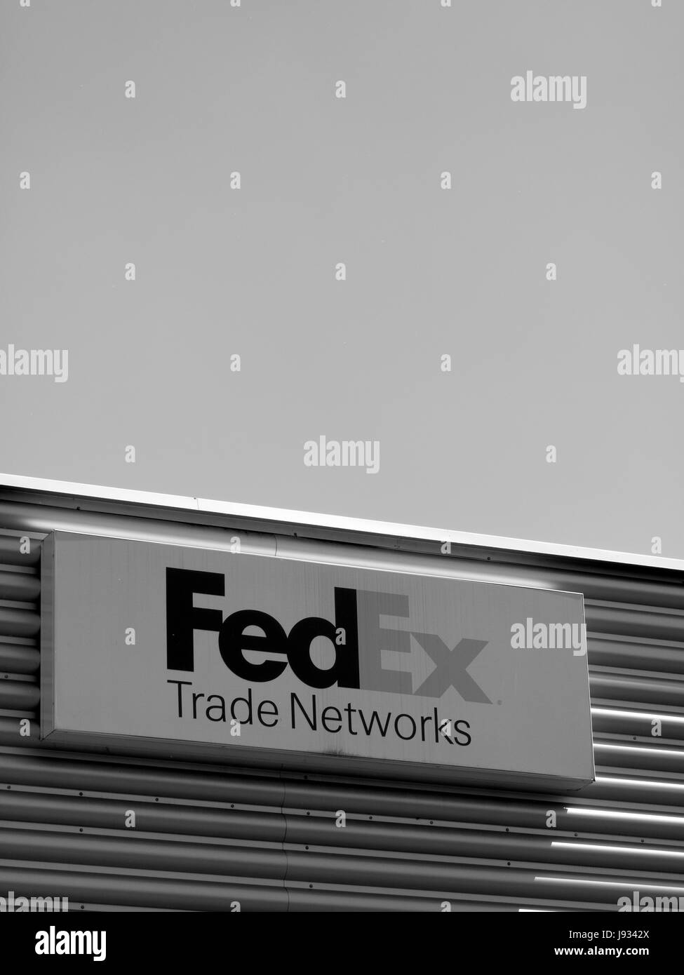 FedEx Corporation sign mounted on side of building, American courier delivery service company Stock Photo