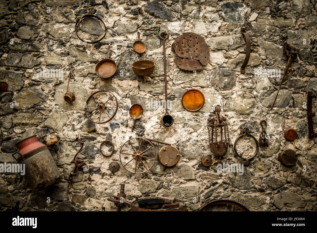 Medieval style rock wall with metallic ornaments. Stock Photo