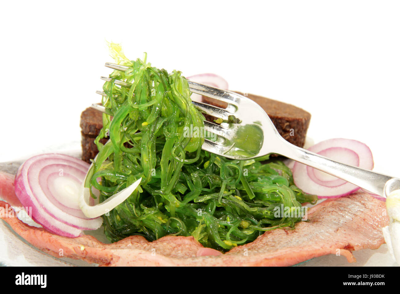matjeshering to seaweed salad Stock Photo